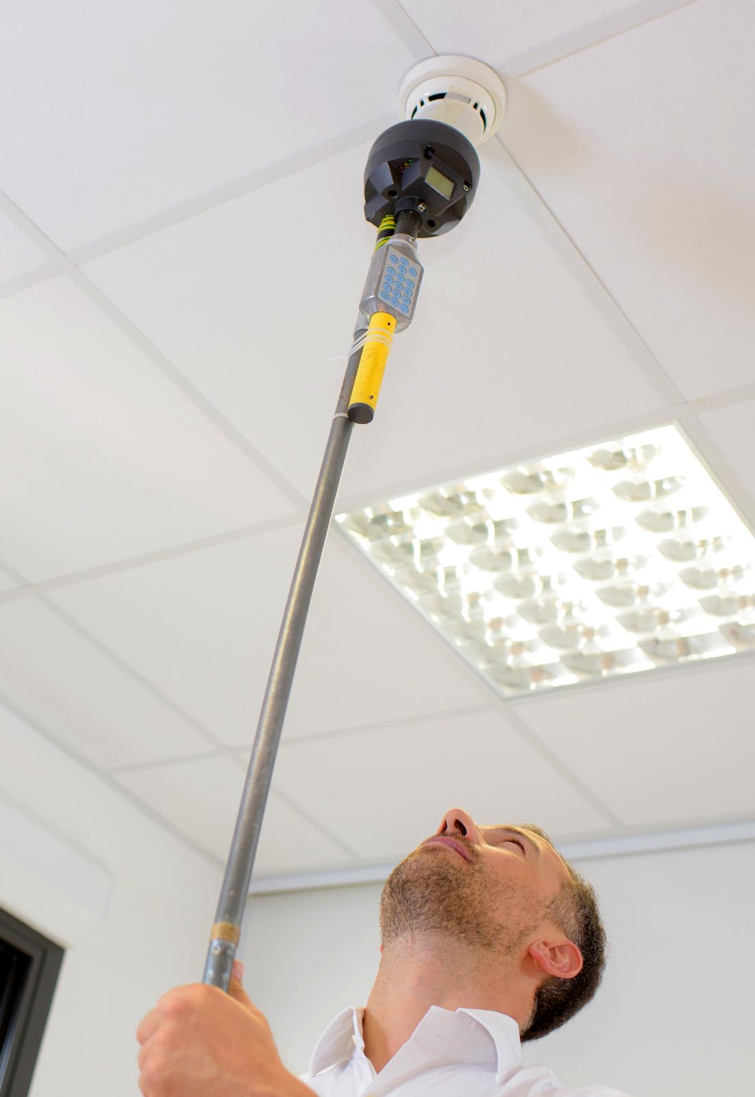 smoke detector inspectors check for compliance